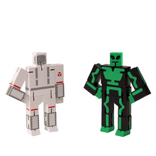 Load image into Gallery viewer, Two robot-themed figurines, one gray and one green with black accents, on a white background.