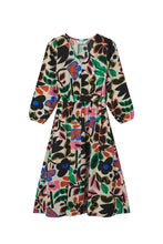 Load image into Gallery viewer, A long-sleeve midi dress with a vibrant, multicolor abstract floral and leaf print on a light beige background, shown flat against a light gray studio backdrop.

