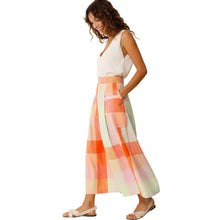 Load image into Gallery viewer, Woman wearing a colorful checkered skirt on a white background
