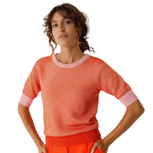 Load image into Gallery viewer, Woman wearing a pink and orange striped sweater with orange pants against a white background
